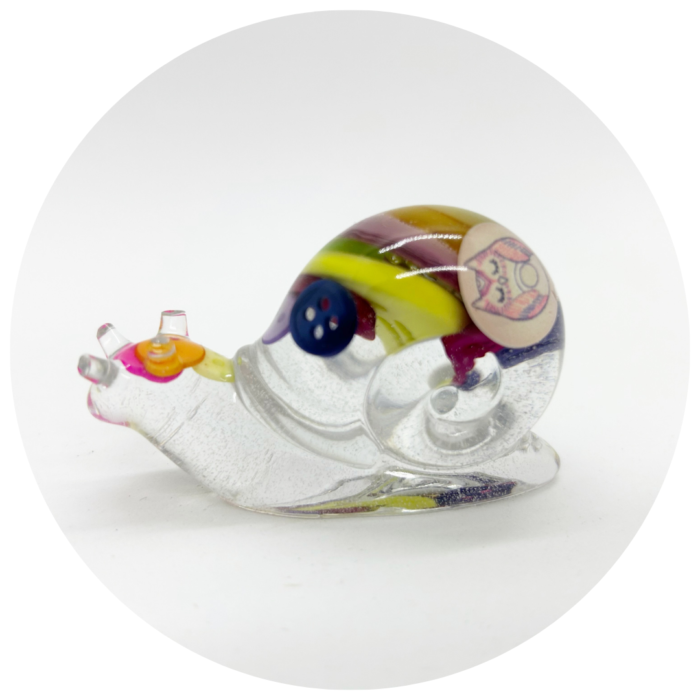 “Meet the slowest (but cutest) addition to your home decor! This quirky handmade snail, crafted from resin and reclaimed buttons, is here to remind you to take life one slime trail at a time. Perfect for snail fans, eco-warriors, or anyone who appreciates a dash of whimsy. This little guy isn’t just a decoration—he’s a conversation starter!”